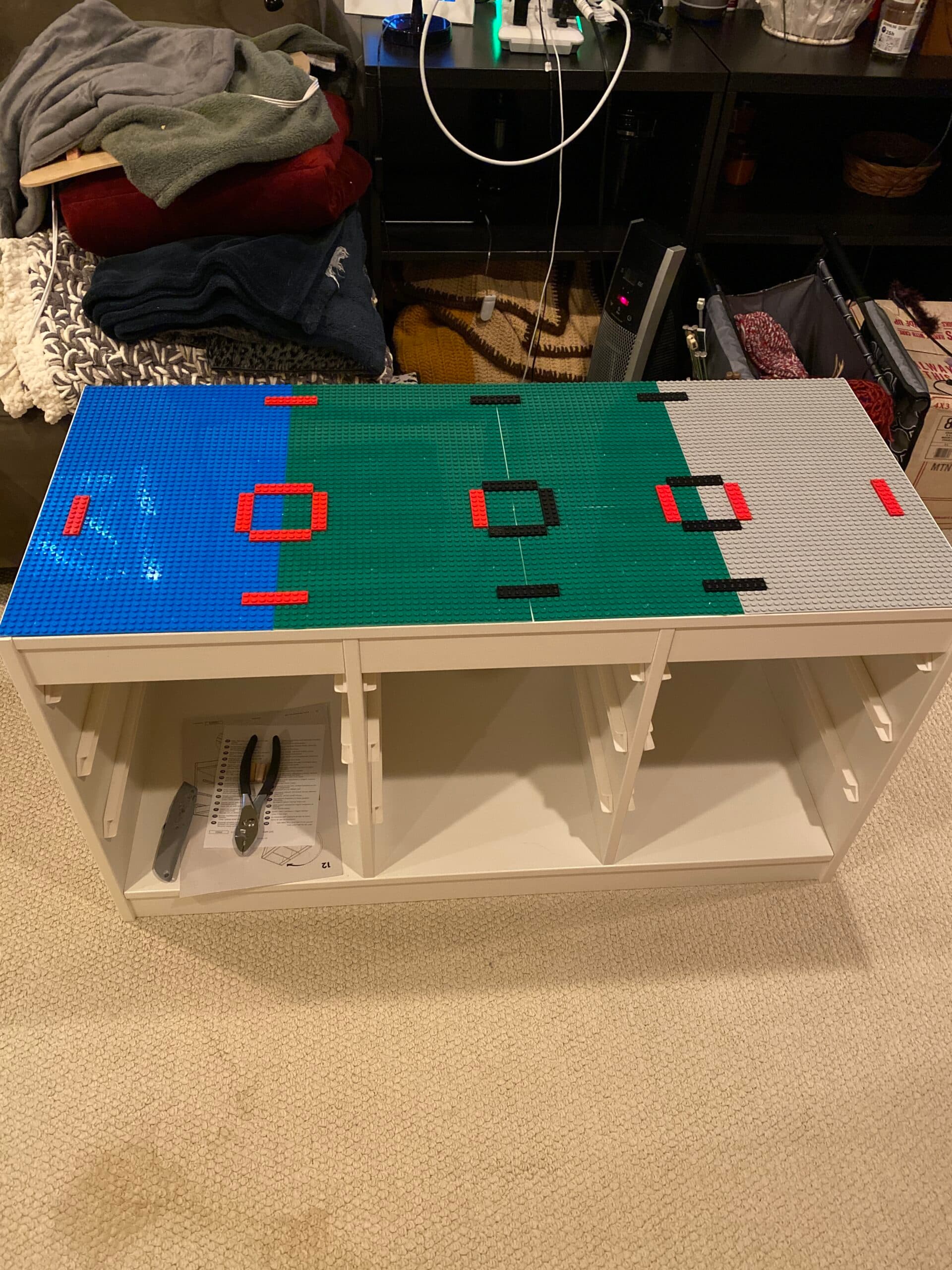 Close-up of the glued LEGO baseplate pattern on the Trofast top
