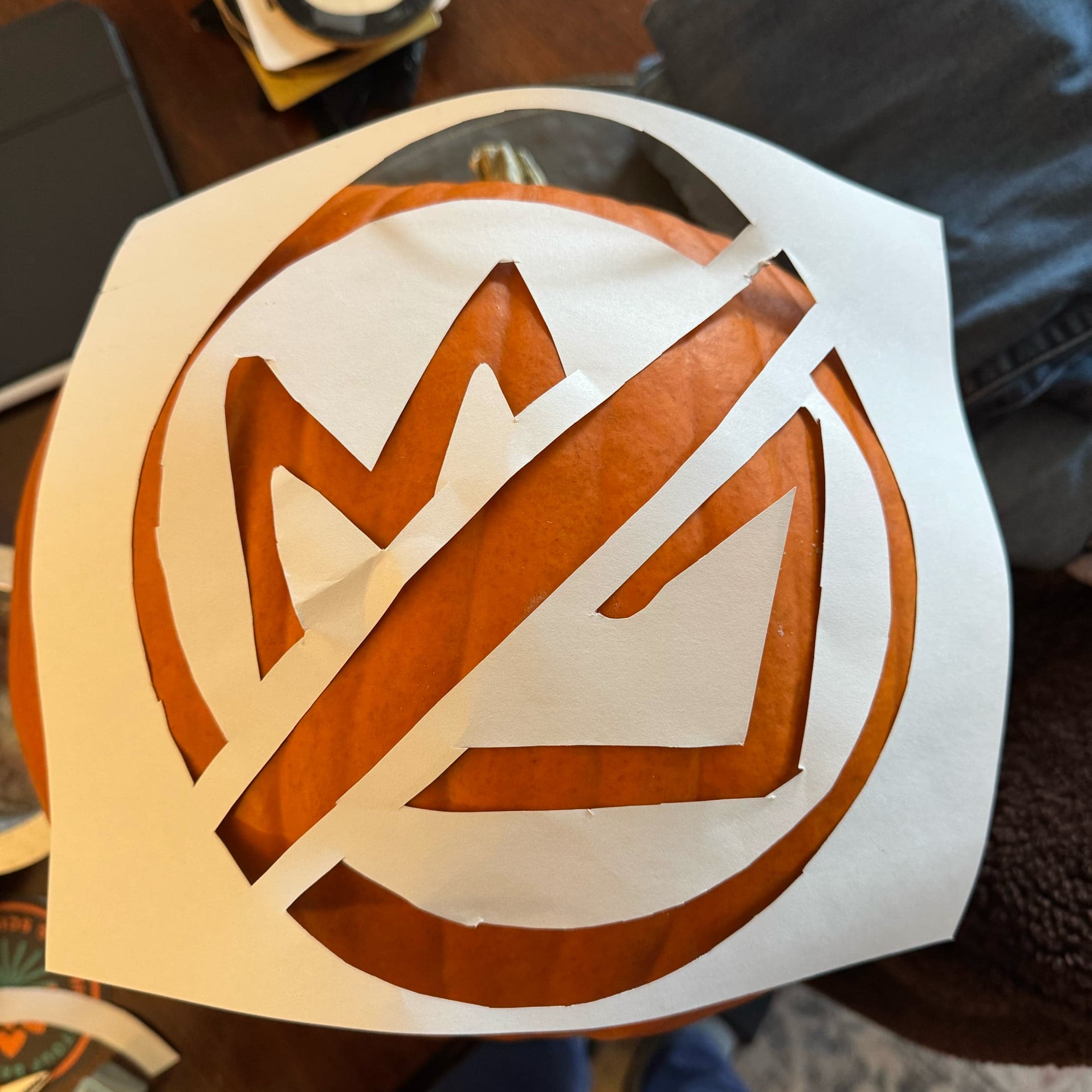 No Kings template cutout and overlaid on the pumpkin